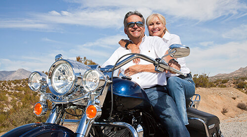 Senior couple riding on a big motorcycle